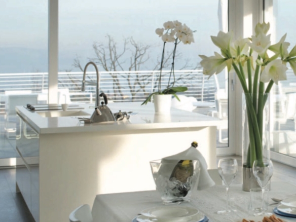 Luxury penthouse dining area with panoramic lake view in Padenghe sul Garda, Lake Garda luxury real estate by MiruVision Real Estate